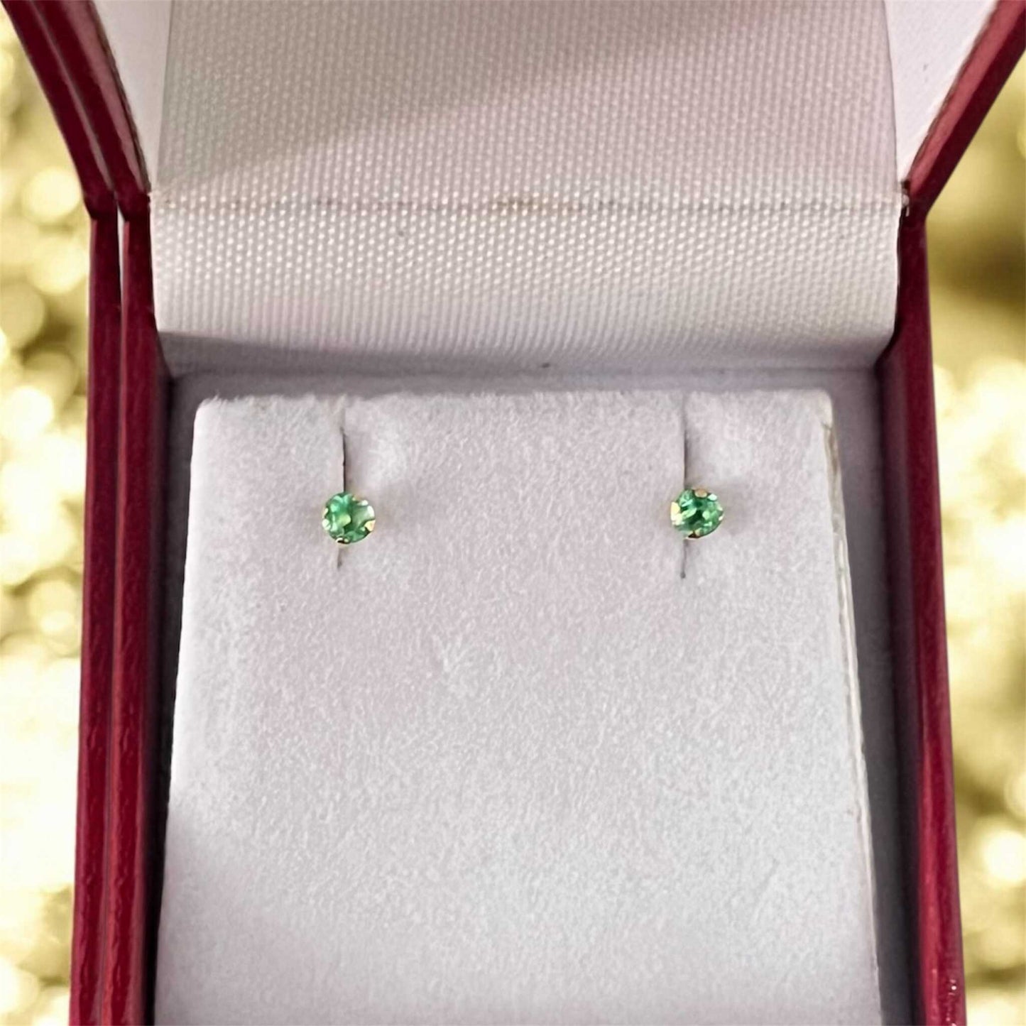 Topos con esmeralda de Oro 18k